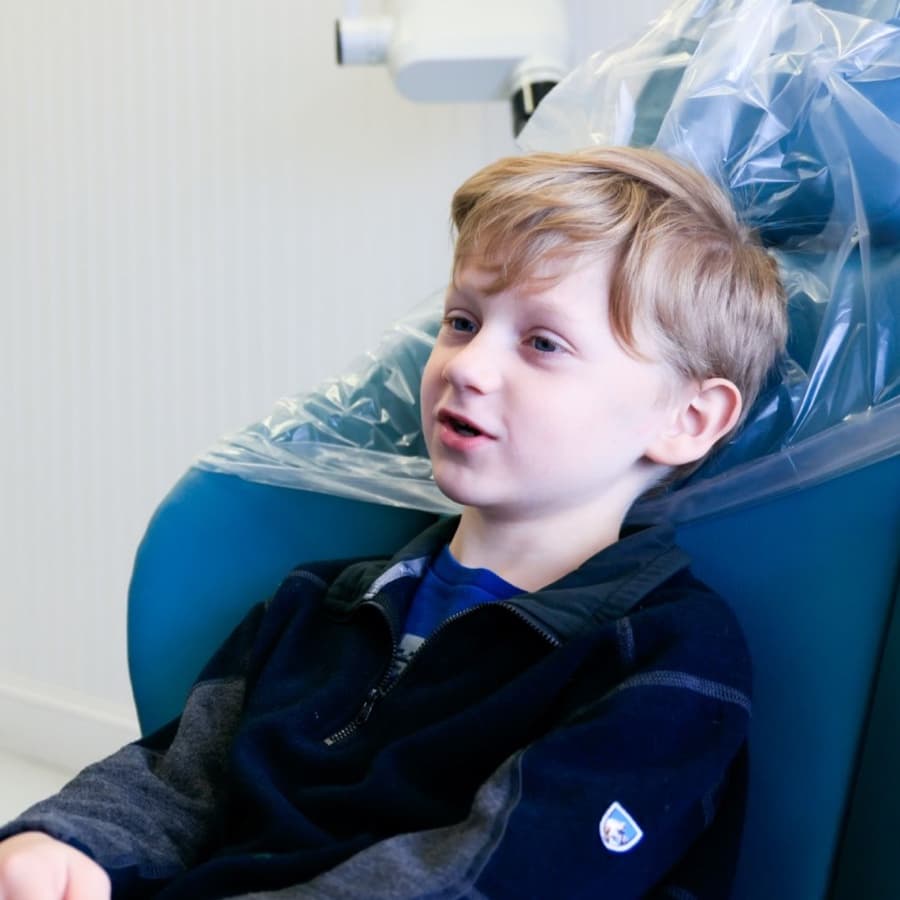 young dental patient smiling during appointment